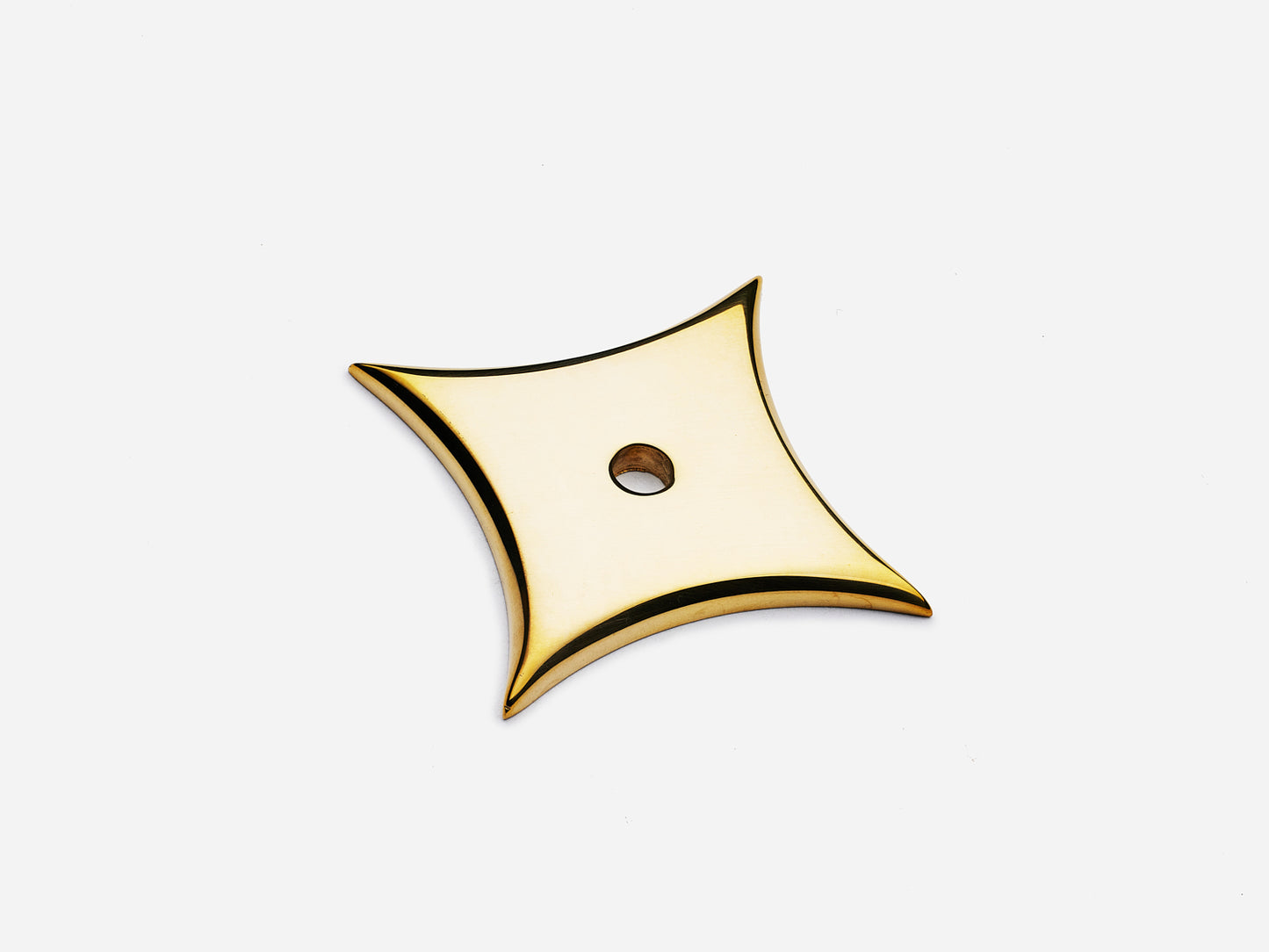 Solid brass 4-Point Star backplate, in an unlacquered polished brass finish for knobs on cabinets.