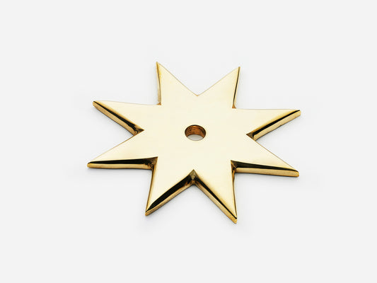 Solid brass 8-Point Star backplate, in an unlacquered polished brass finish for knobs on cabinets.