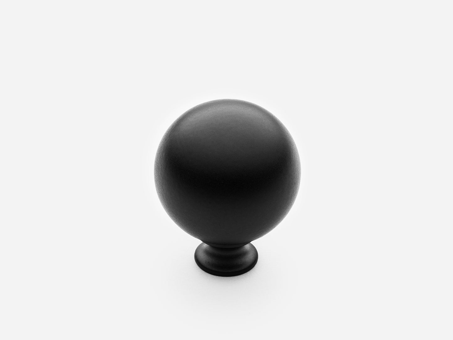 Solid brass Ball Knob, standard size, in a matte black finish for cabinets.
