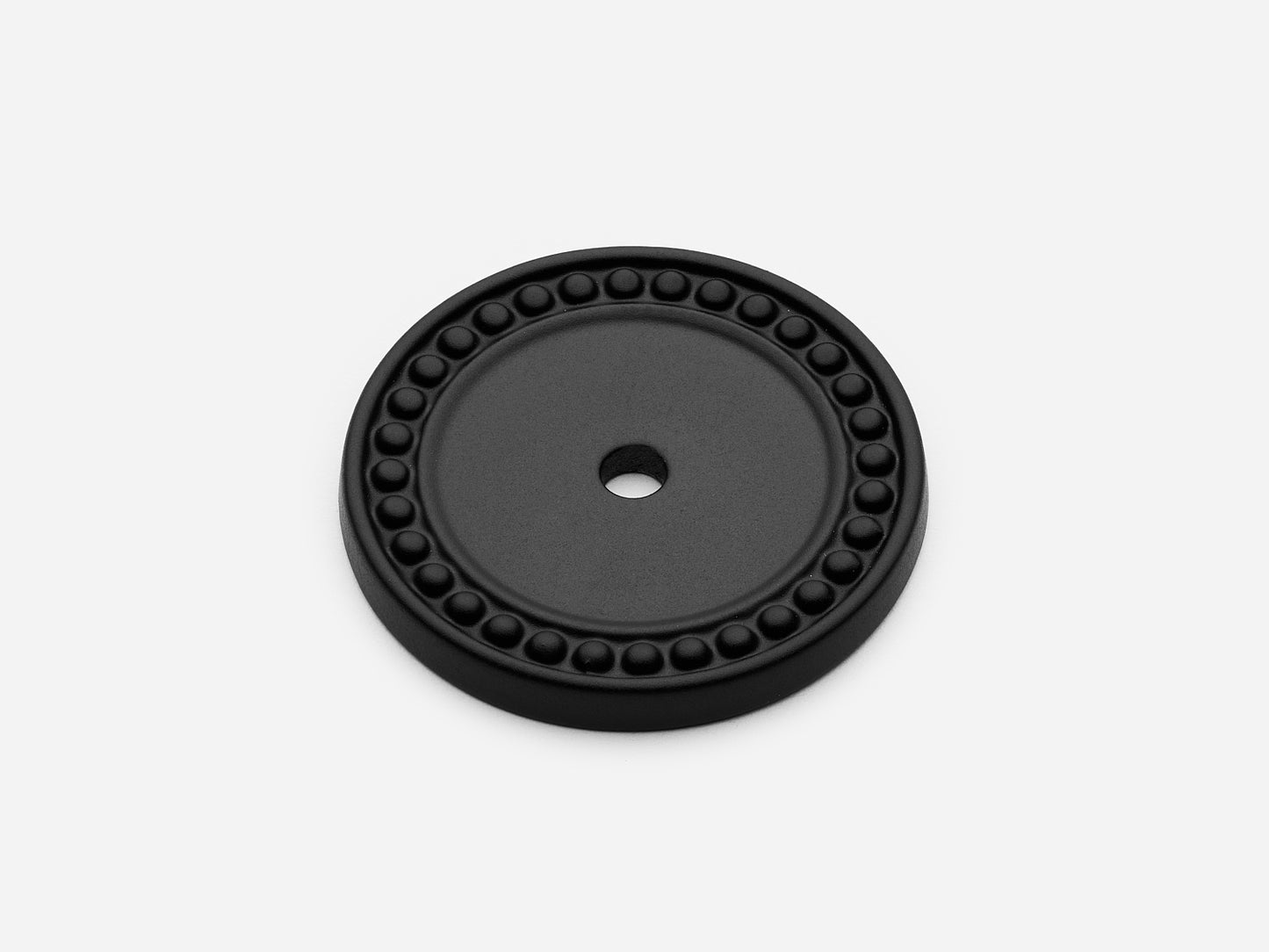 Solid brass Beaded Round backplate, in a matte black finish for knobs on cabinets.