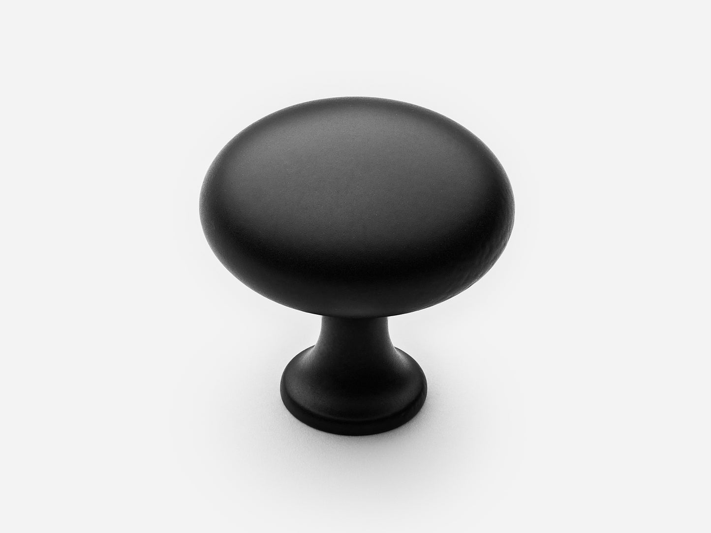 Solid brass Belle Knob, large size, in a matte black finish for cabinets.