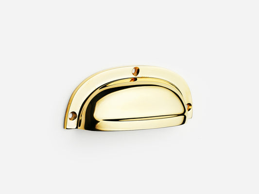 Solid brass Admiral bin pull, 4 inches, in an unlacquered polished brass finish for cabinets.