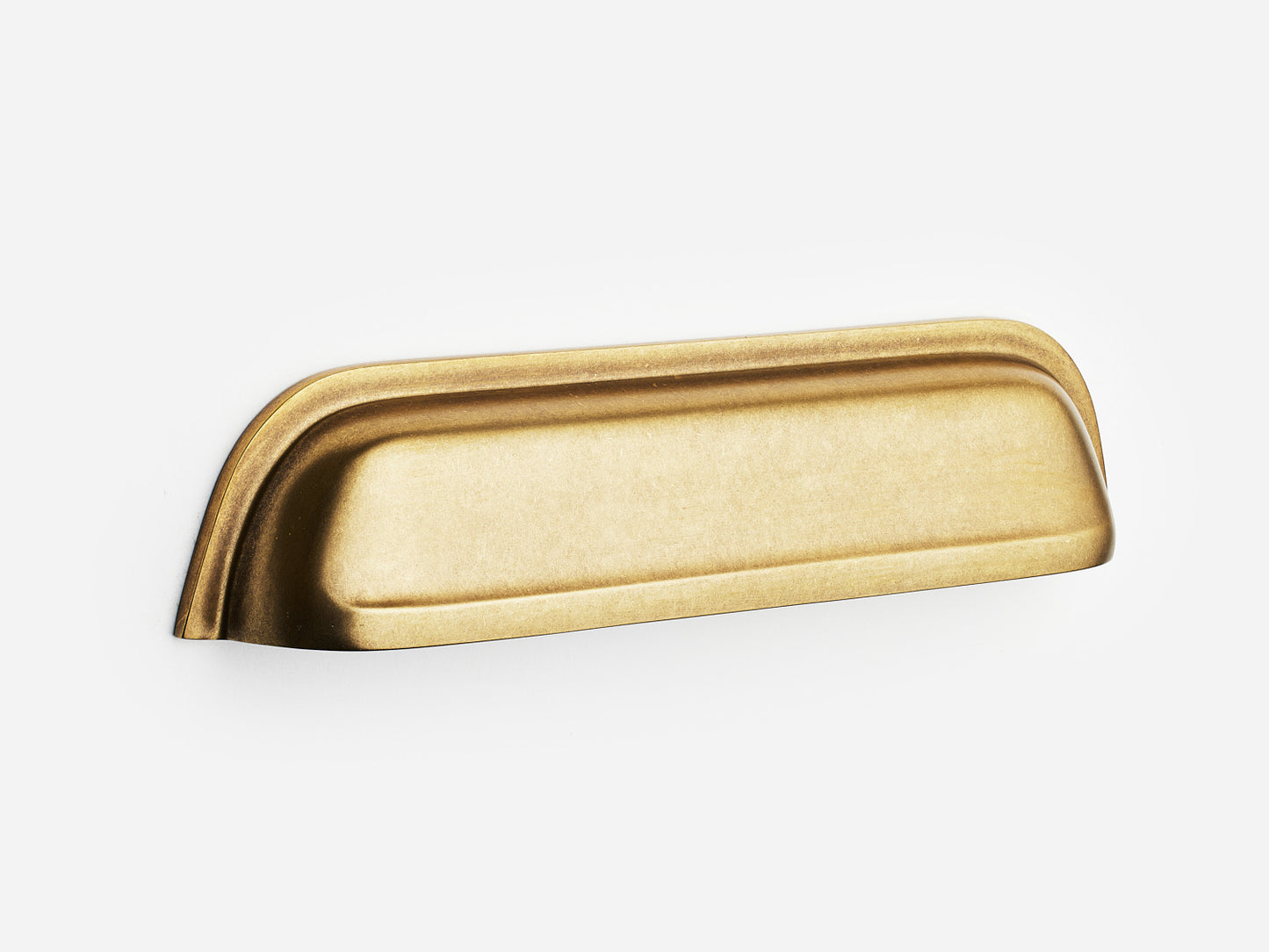 Solid brass Cygnet bin pull, 6 inches, in an aged brass finish for cabinets.