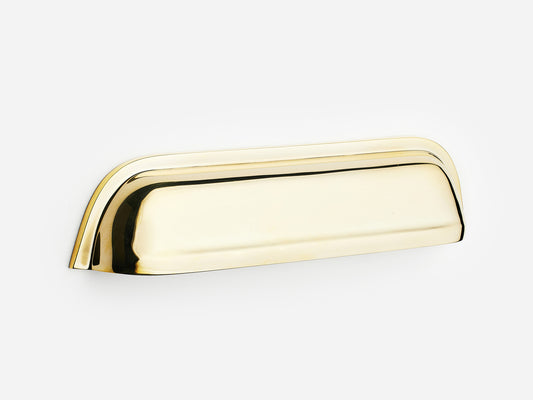 Solid brass Cygnet bin pull, 6 inches, in an unlacquered polished brass finish for cabinets.