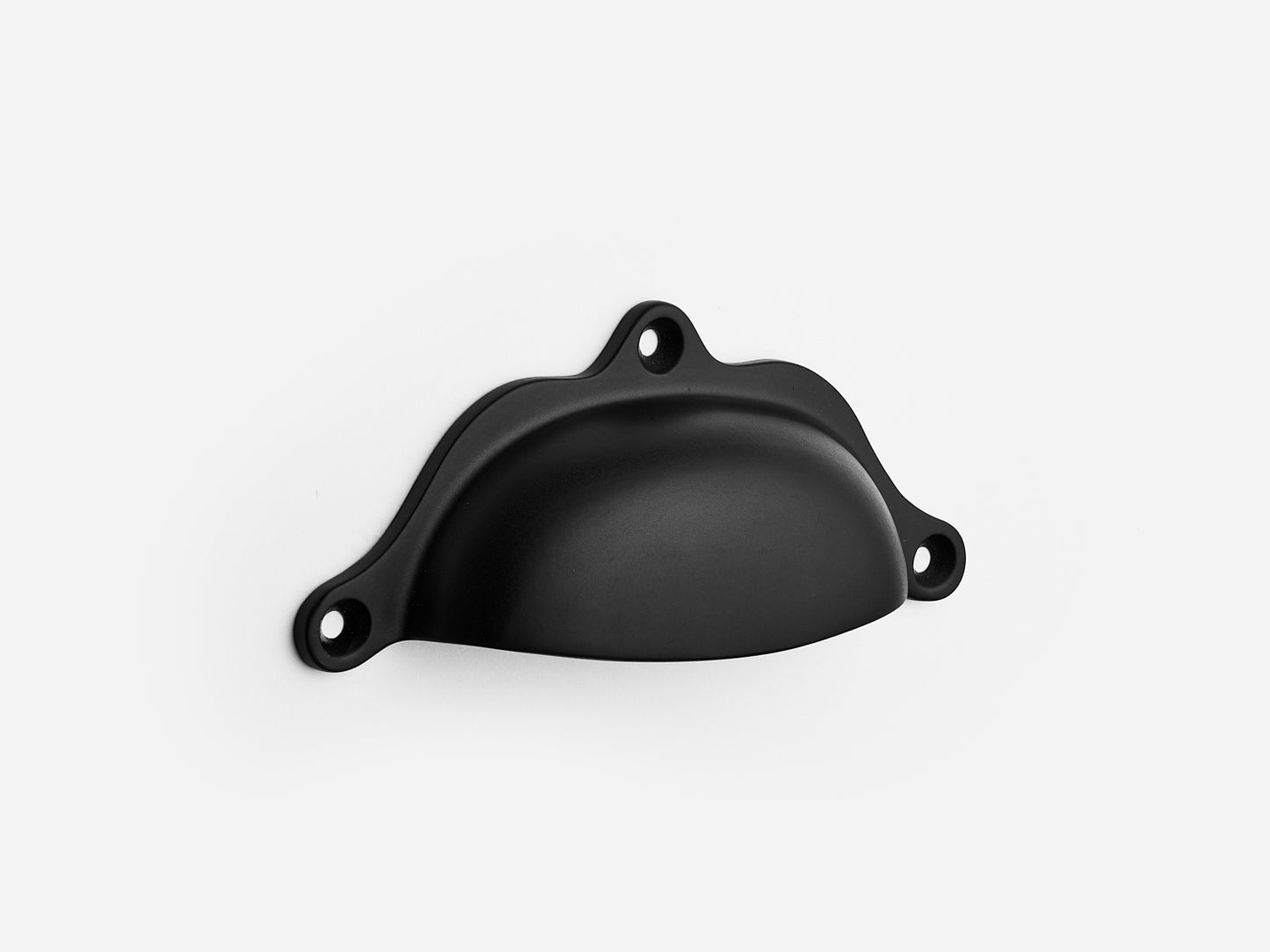 Solid brass Grace bin pull, 4 inches, in a matte black finish for cabinets.