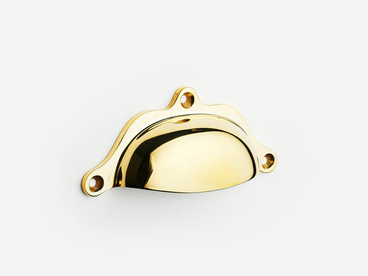 Solid brass Grace bin pull, 4 inches, in an unlacquered polished brass finish for cabinets.
