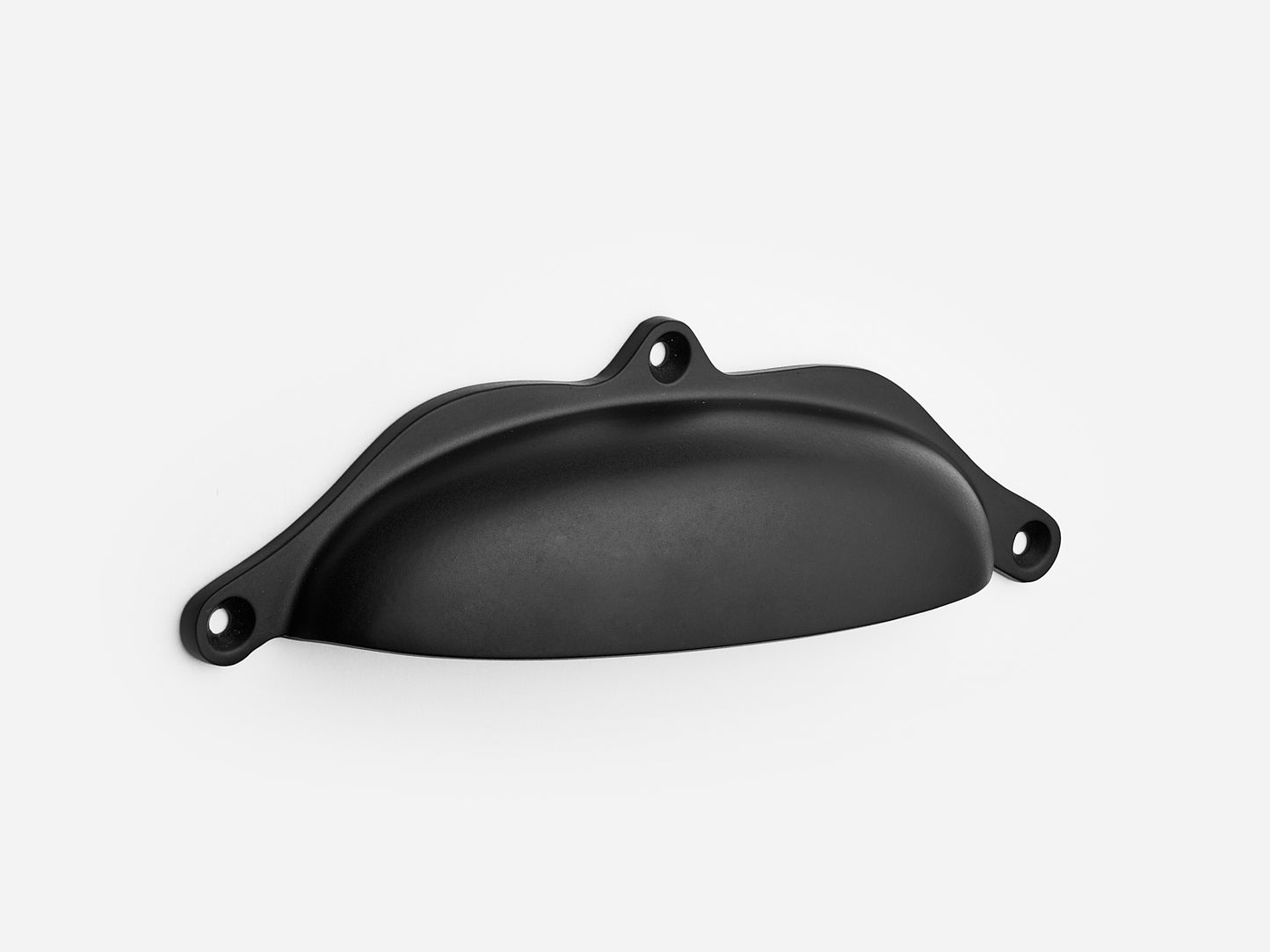 Solid brass Grace bin pull, 6 inches, in a matte black finish for cabinets.