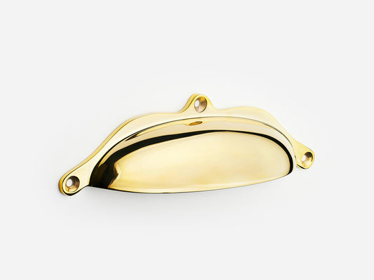 Solid brass Grace bin pull, 6 inches, in an unlacquered polished brass finish for cabinets.