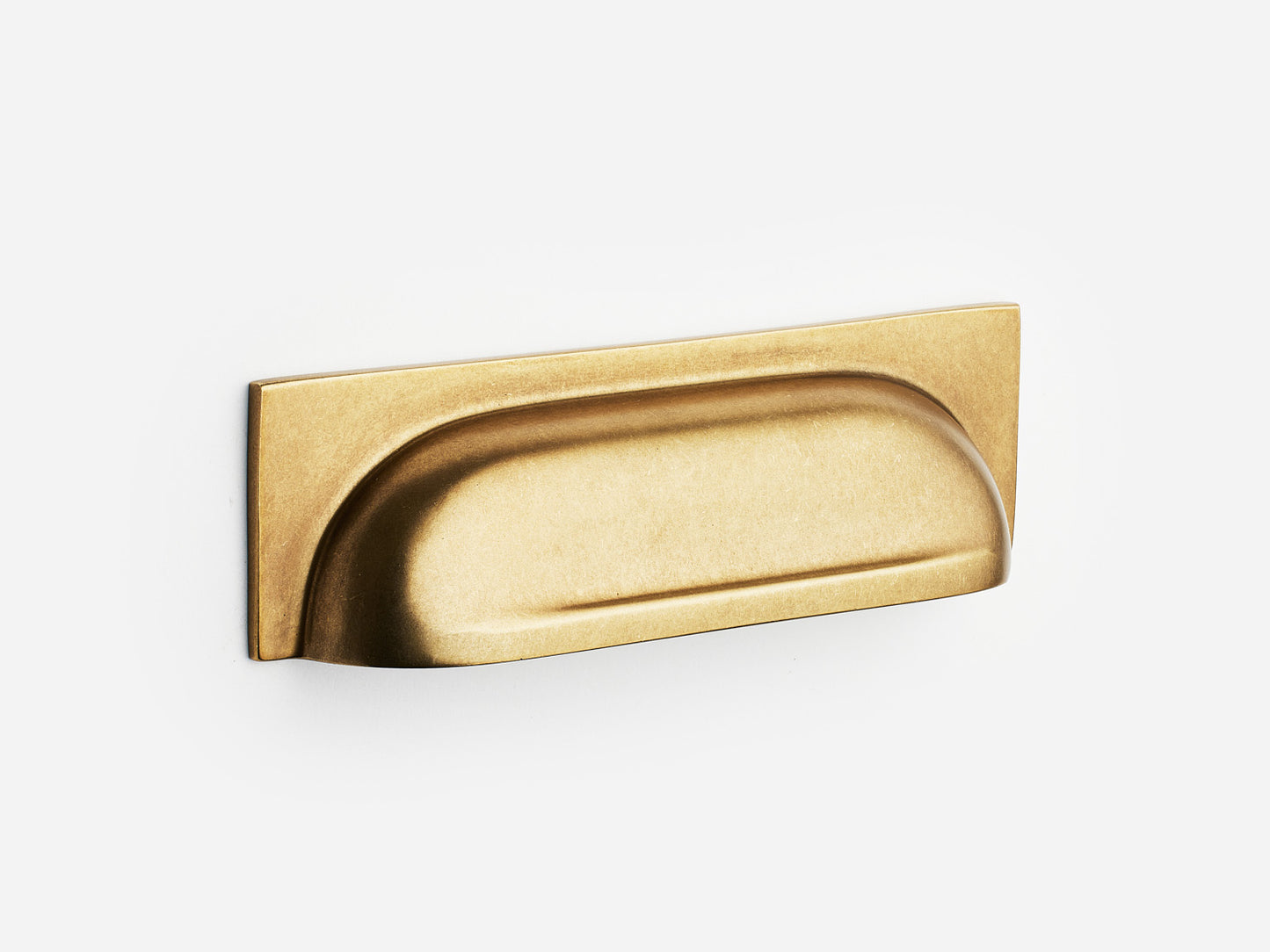 Solid brass Suffolk bin pull, 4 inches, in an aged brass finish for cabinets.