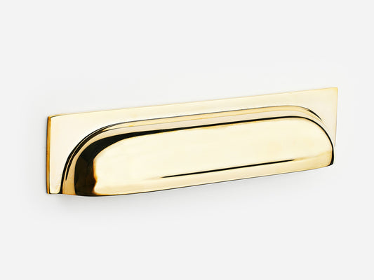 Solid brass Suffolk bin pull, 6 inches, in an unlacquered polished brass finish for cabinets.