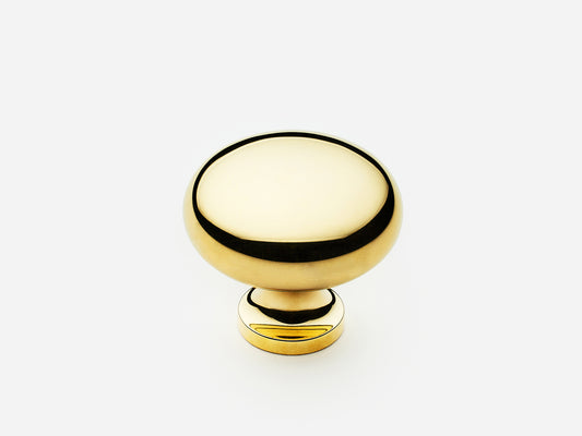 Solid brass Classic Knob, standard size, in an unlacquered polished brass finish for cabinets.