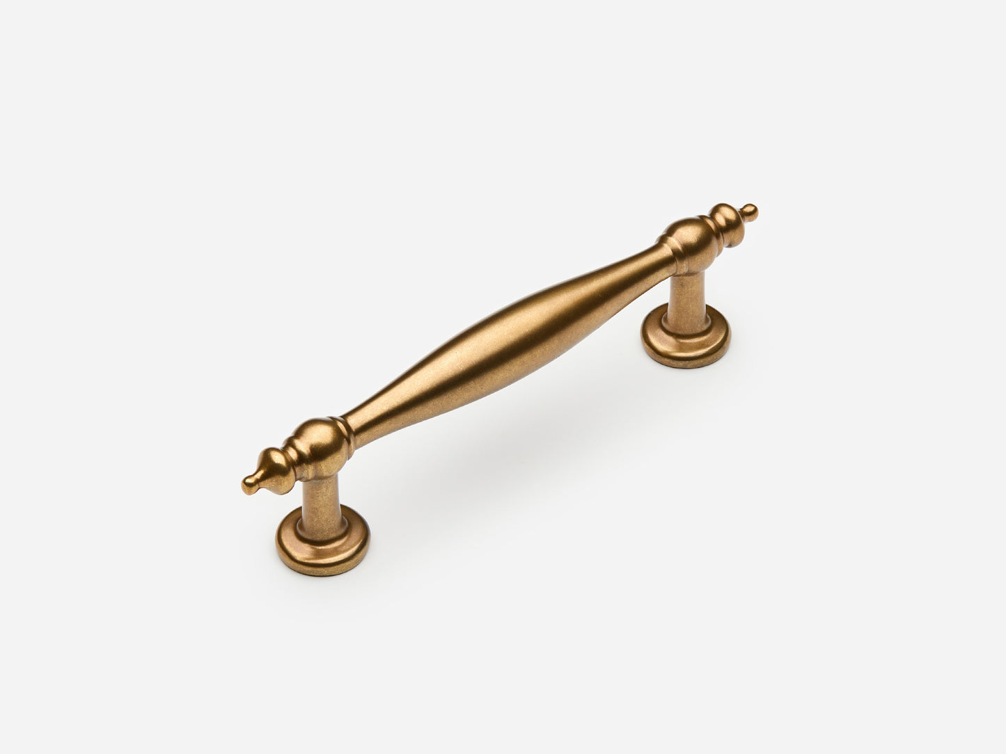 Solid brass Bougie drawer pull, 4 inches, in an aged brass finish for cabinets.