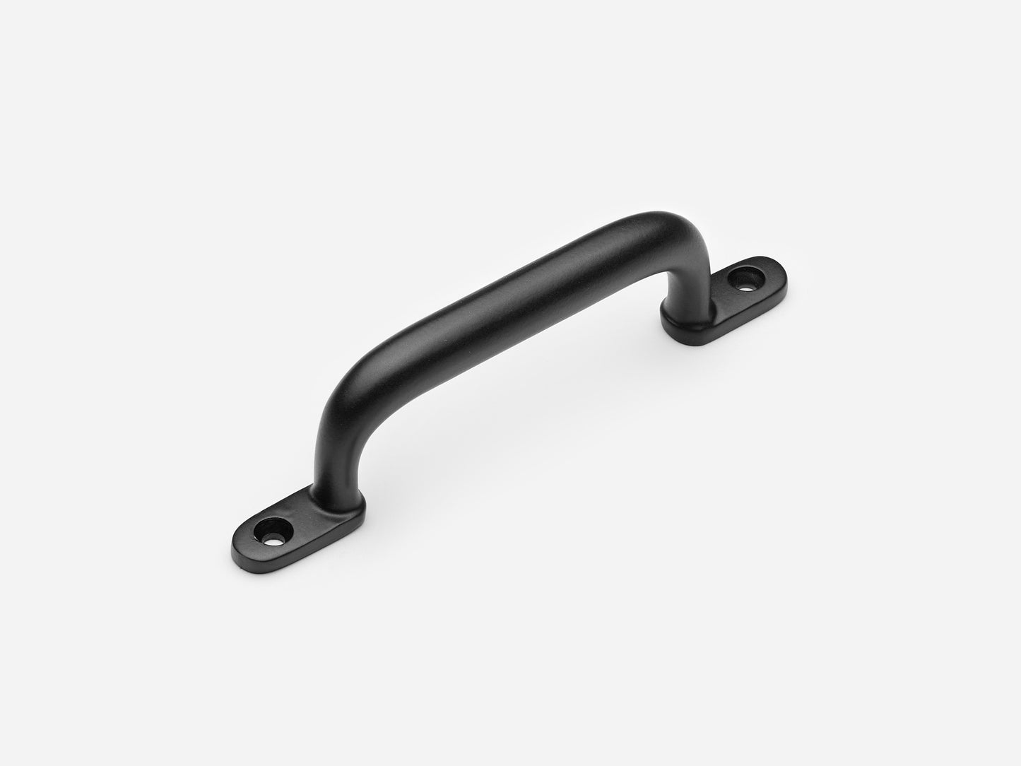 Solid brass Butler drawer pull, 4 inches, in a matte black finish for cabinets.