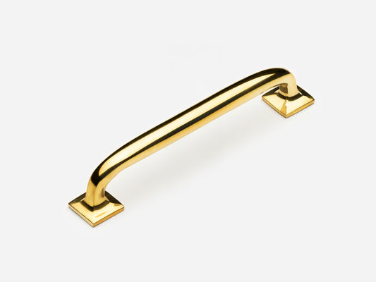Solid brass Dapper drawer pull, 6 inches, in an unlacquered polished brass finish for cabinets.