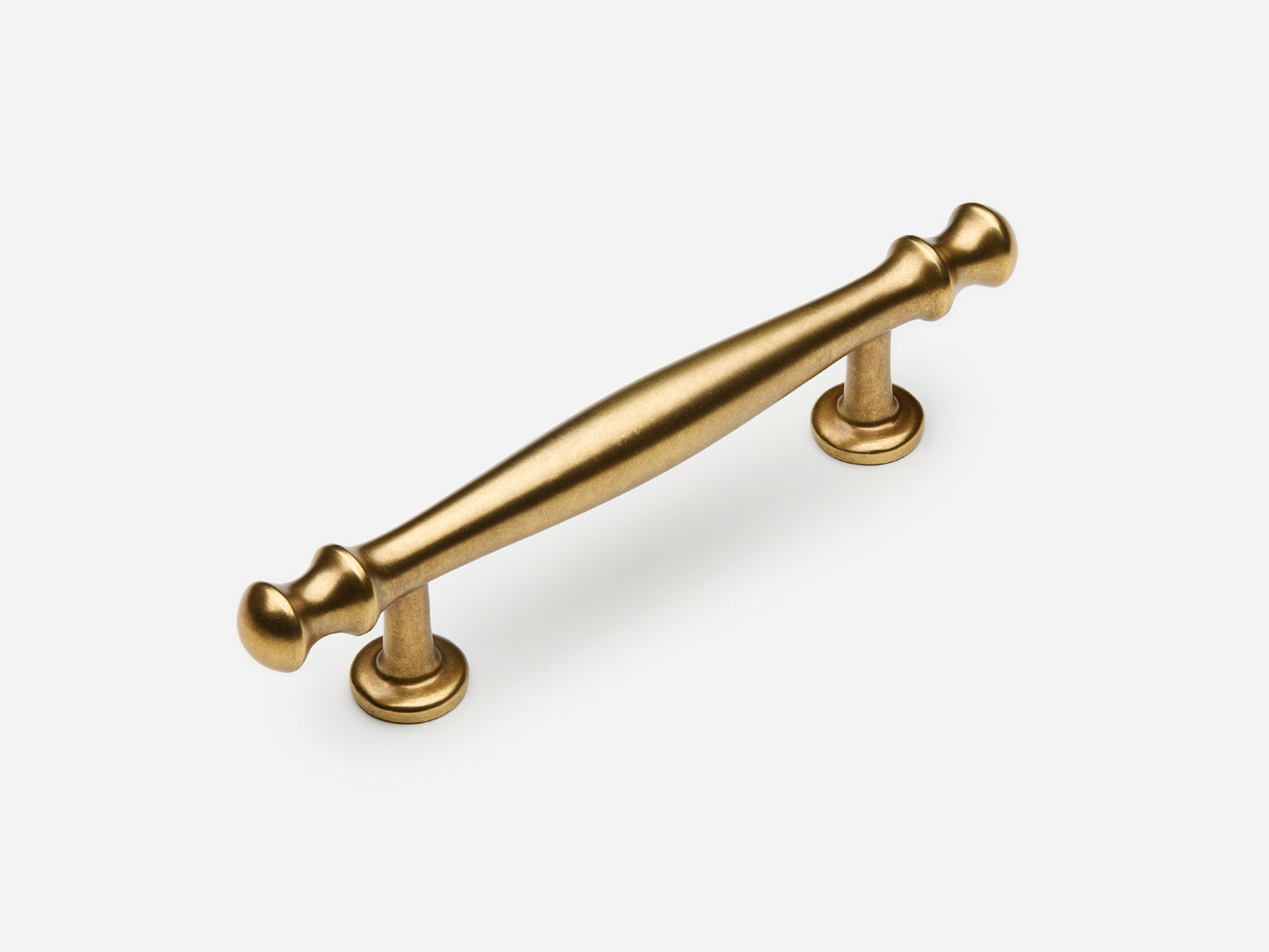 Solid brass Helena drawer pull, 4 inches, in an aged brass finish for cabinets.