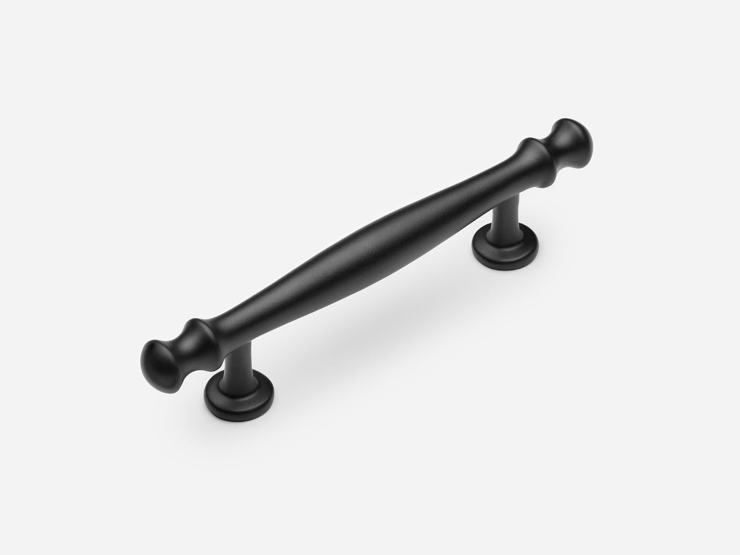 Solid brass Helena drawer pull, 4 inches, in a matte black finish for cabinets.