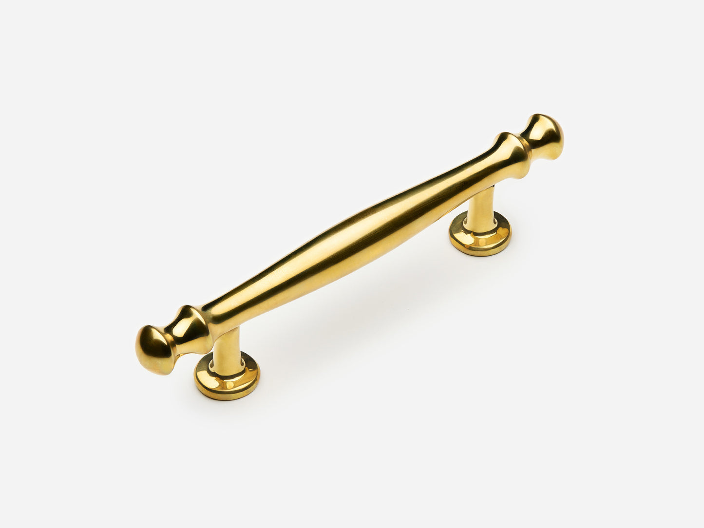 Solid brass Helena drawer pull, 4 inches, in an unlacquered polished brass finish for cabinets.