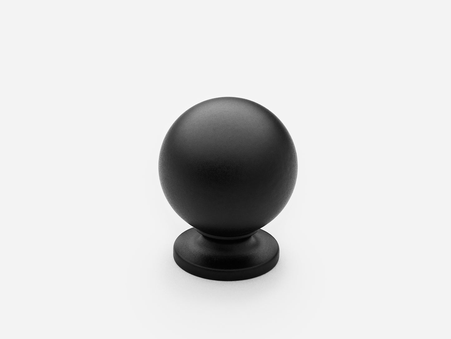 Solid brass Luxe Ball Knob, standard size, in a matte black finish for cabinets.
