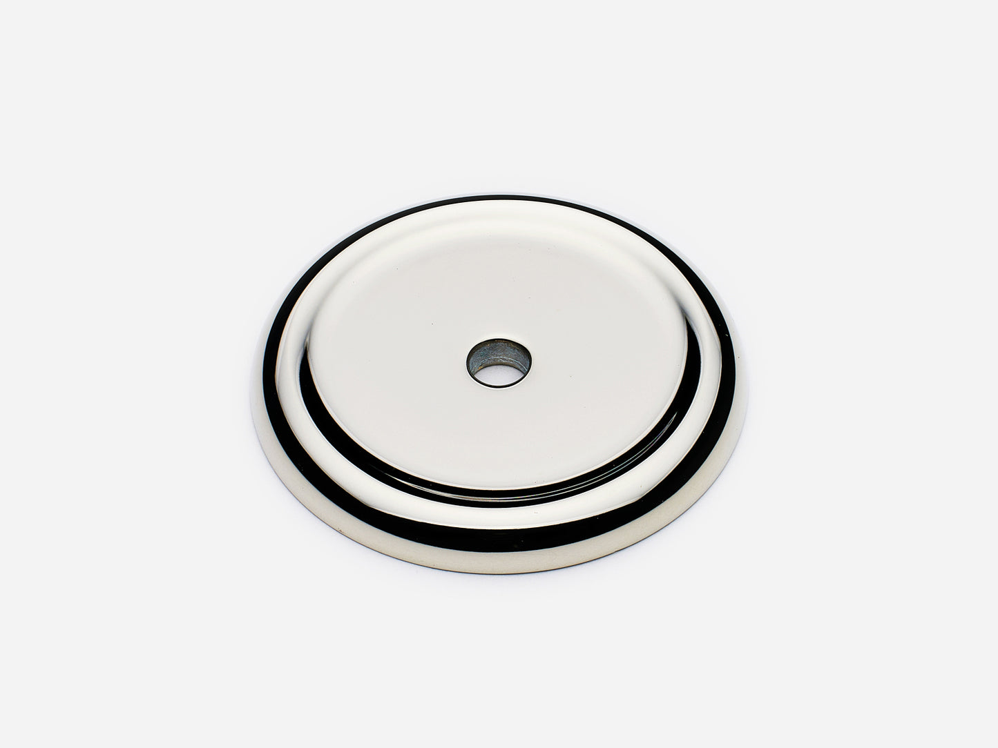 Solid brass Raised Round backplate, in a polished nickel finish for knobs on cabinets.