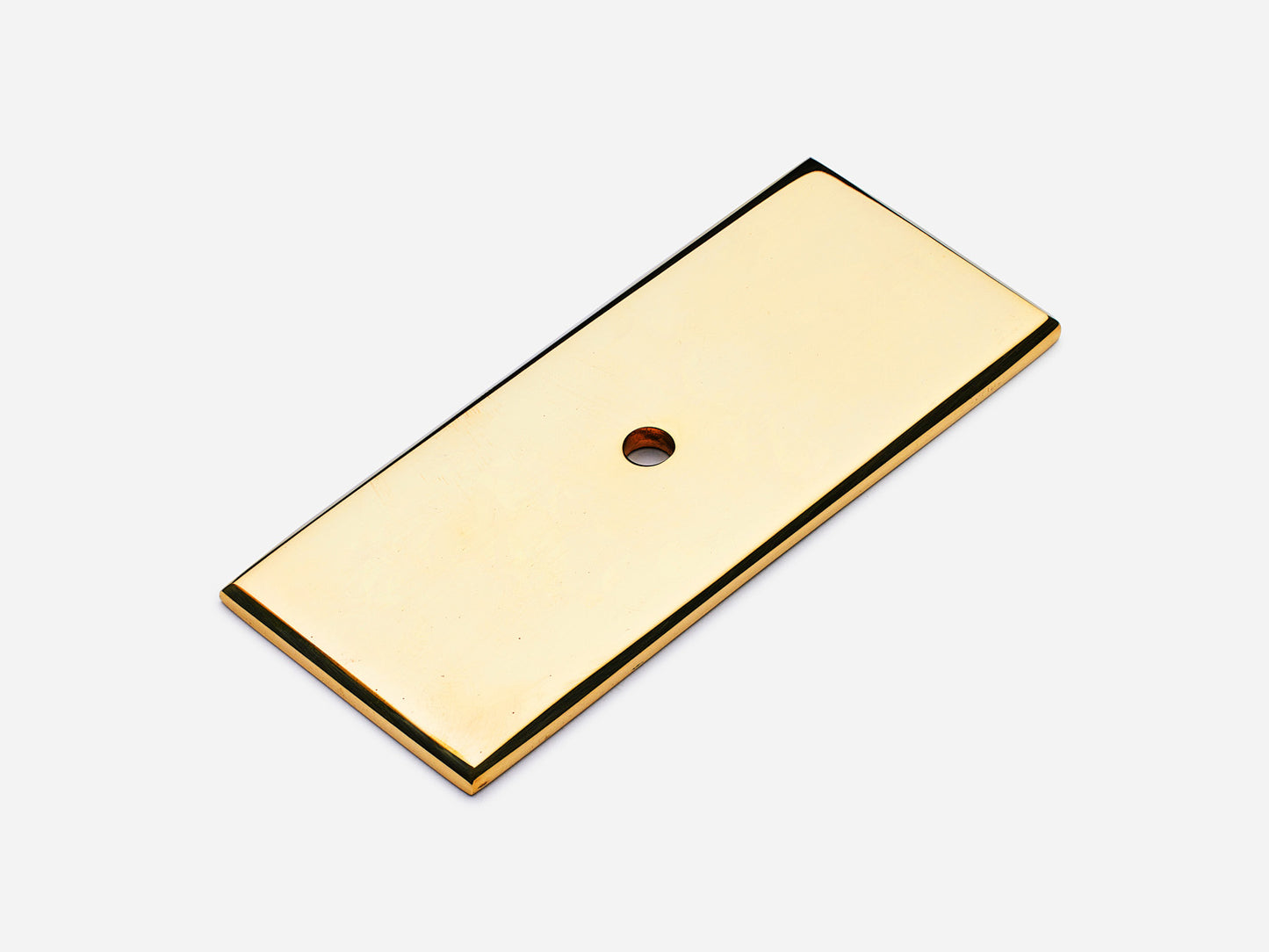 Solid brass rectangular backplate, 1.25x3 inches, unlacquered polished brass finish for knobs and pulls on cabinets.