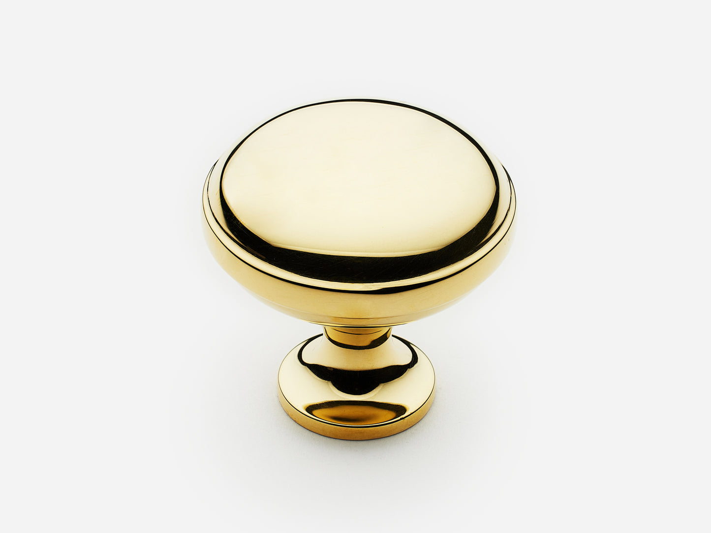 Solid brass Royal Knob, large size, in an unlacquered polished brass finish for cabinets.