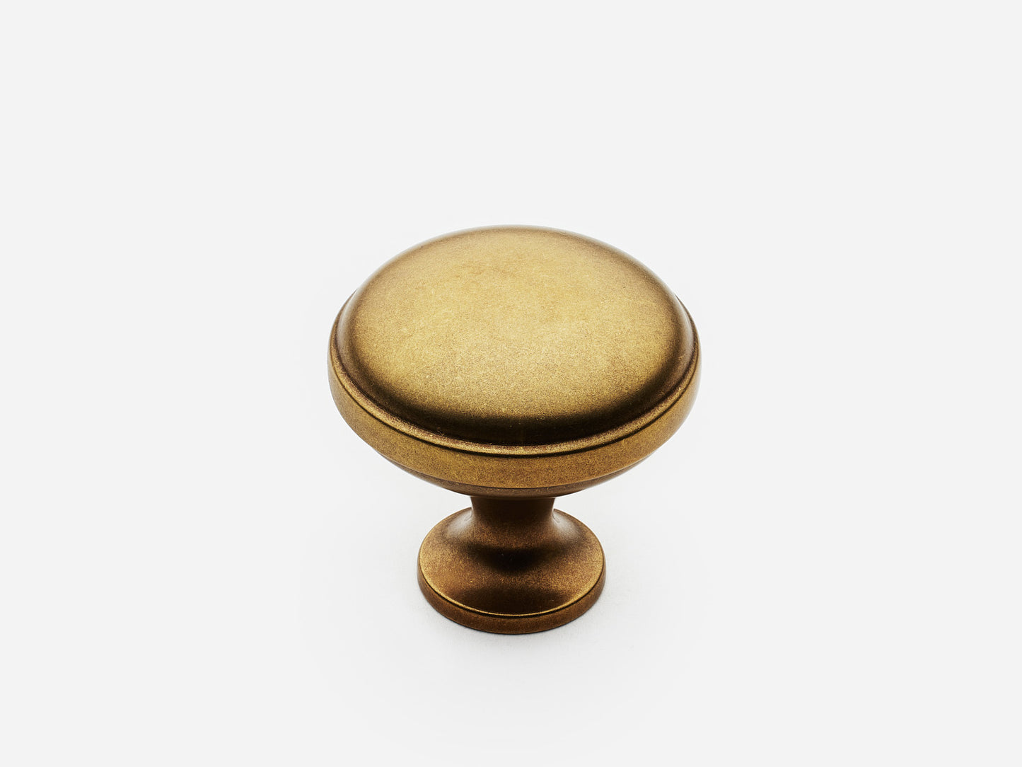 Solid brass Royal Knob, standard size, in an aged brass finish for cabinets.