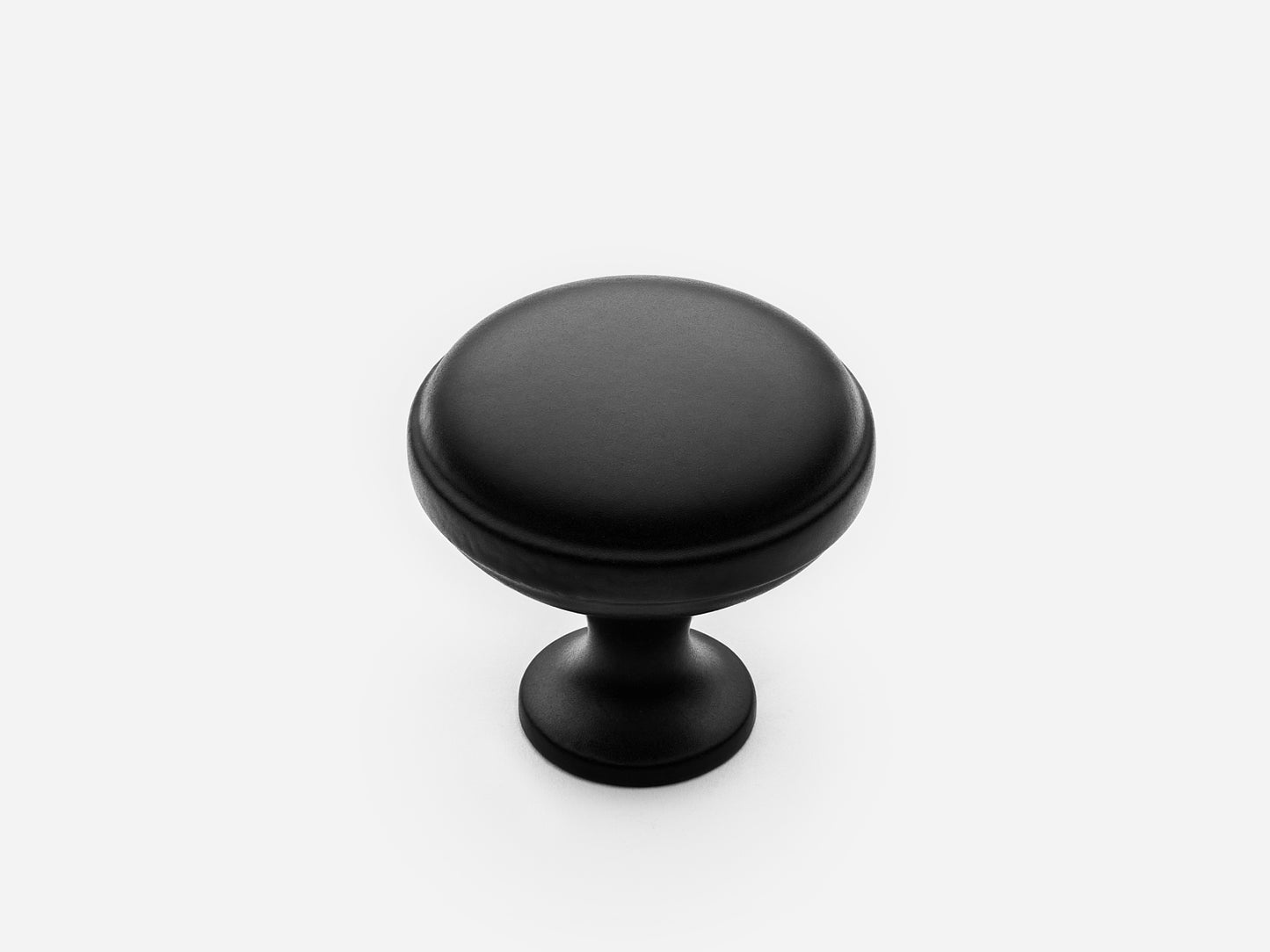 Solid brass Royal Knob, standard size, in a matte black finish for cabinets.
