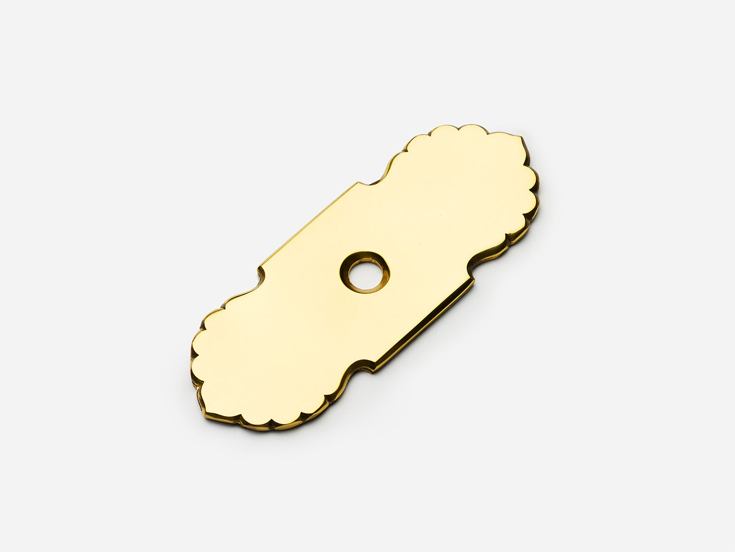 Solid brass Scalloped backplate, 1x2.75 inches, unlacquered polished brass finish for knobs on cabinets.