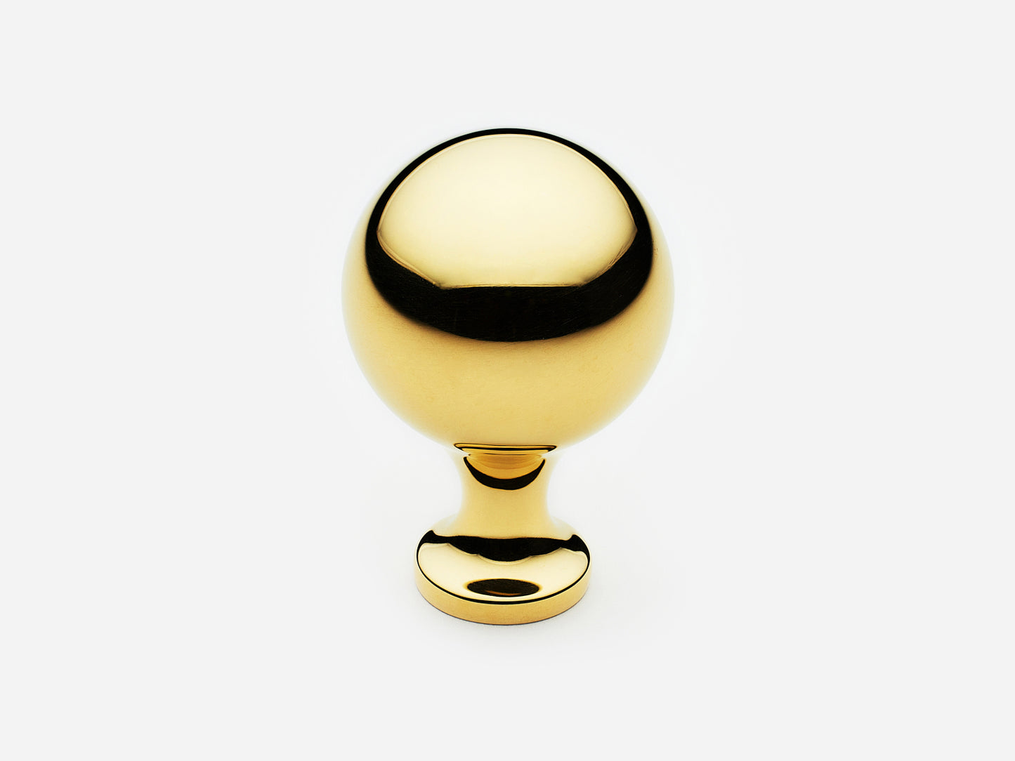 Solid brass Serenity Knob, large size, in an unlacquered polished brass finish for cabinets.