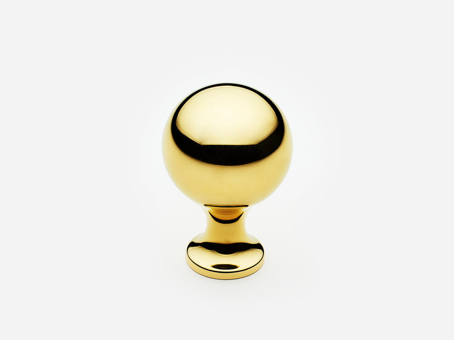 Solid brass Serenity Knob, standard size, in an unlacquered polished brass finish for cabinets.