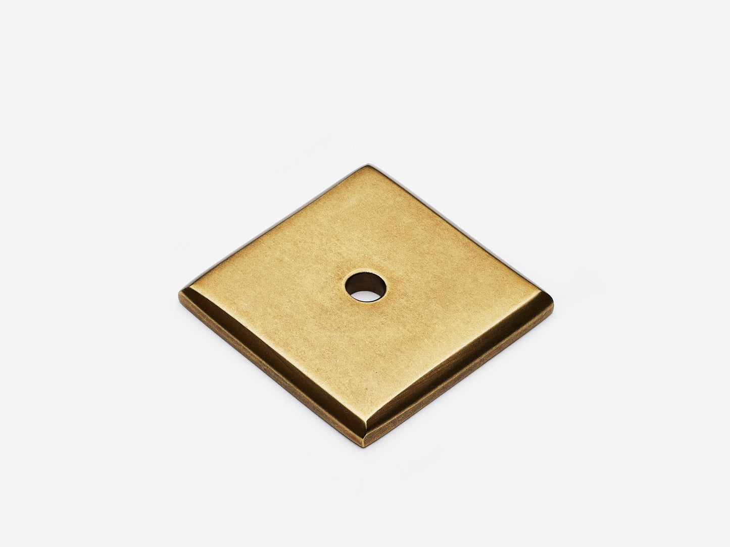 Solid brass Square backplate, 1.25 inches, in an aged brass finish for knobs on cabinets.