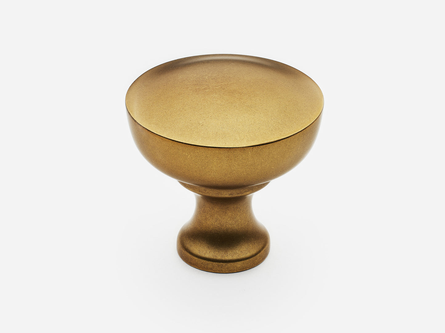 Solid brass Triumph Knob, large size, in an aged brass finish for cabinets.