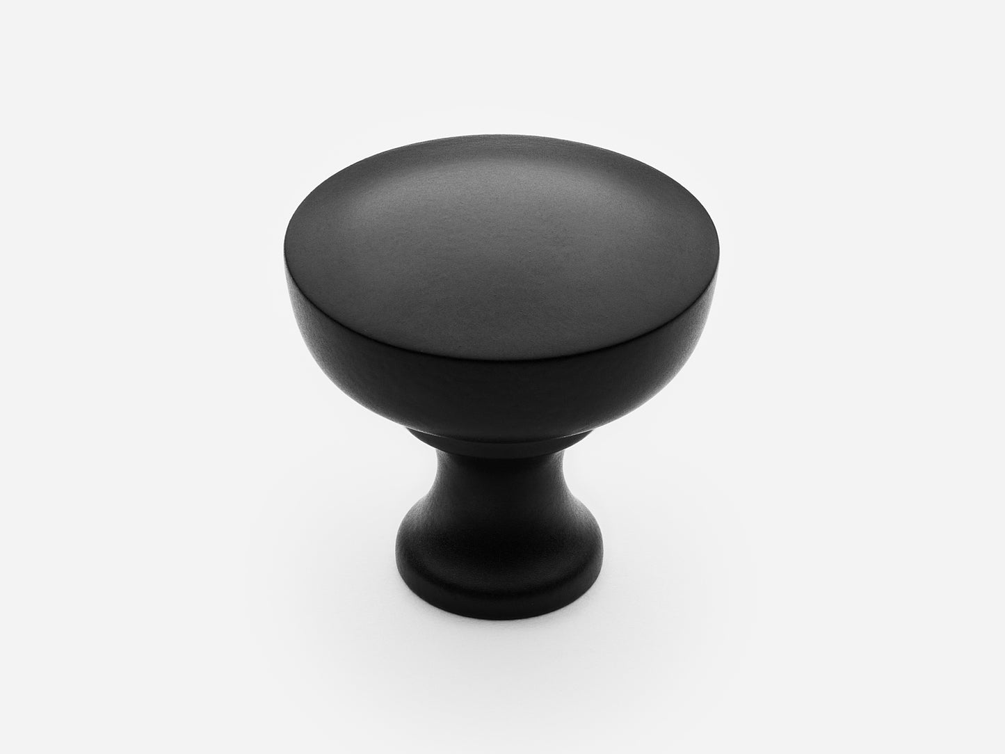 Solid brass Triumph Knob, large size, in a matte black finish for cabinets.