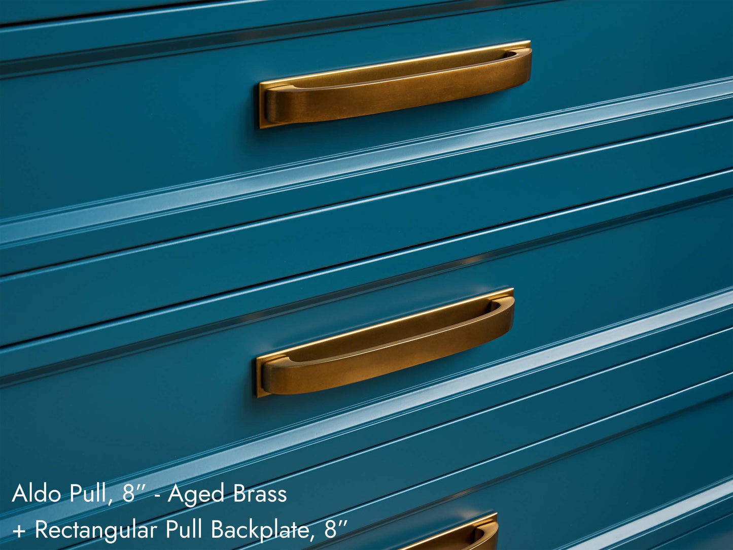 Solid brass Aldo Pulls with Rectangular Backplates, in aged brass finish, on kitchen cabinets.
