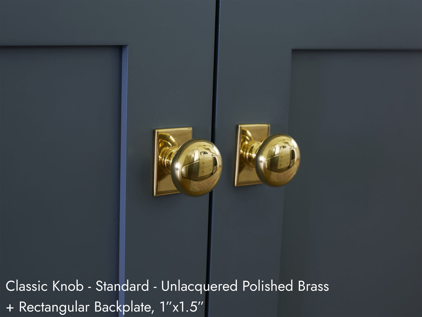Solid brass Classic Knob, in unlacquered polished brass finish, on kitchen cabinets with Rectangular Backplate.