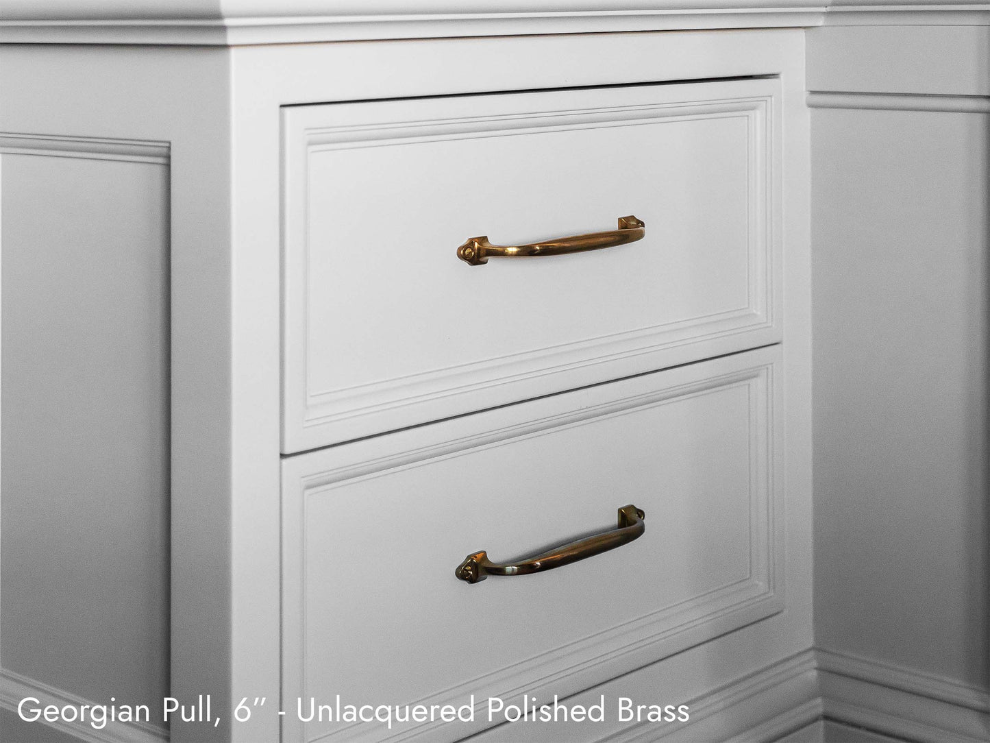 Solid brass Georgian Pull, in unlacquered polished brass, on kitchen cabinets.