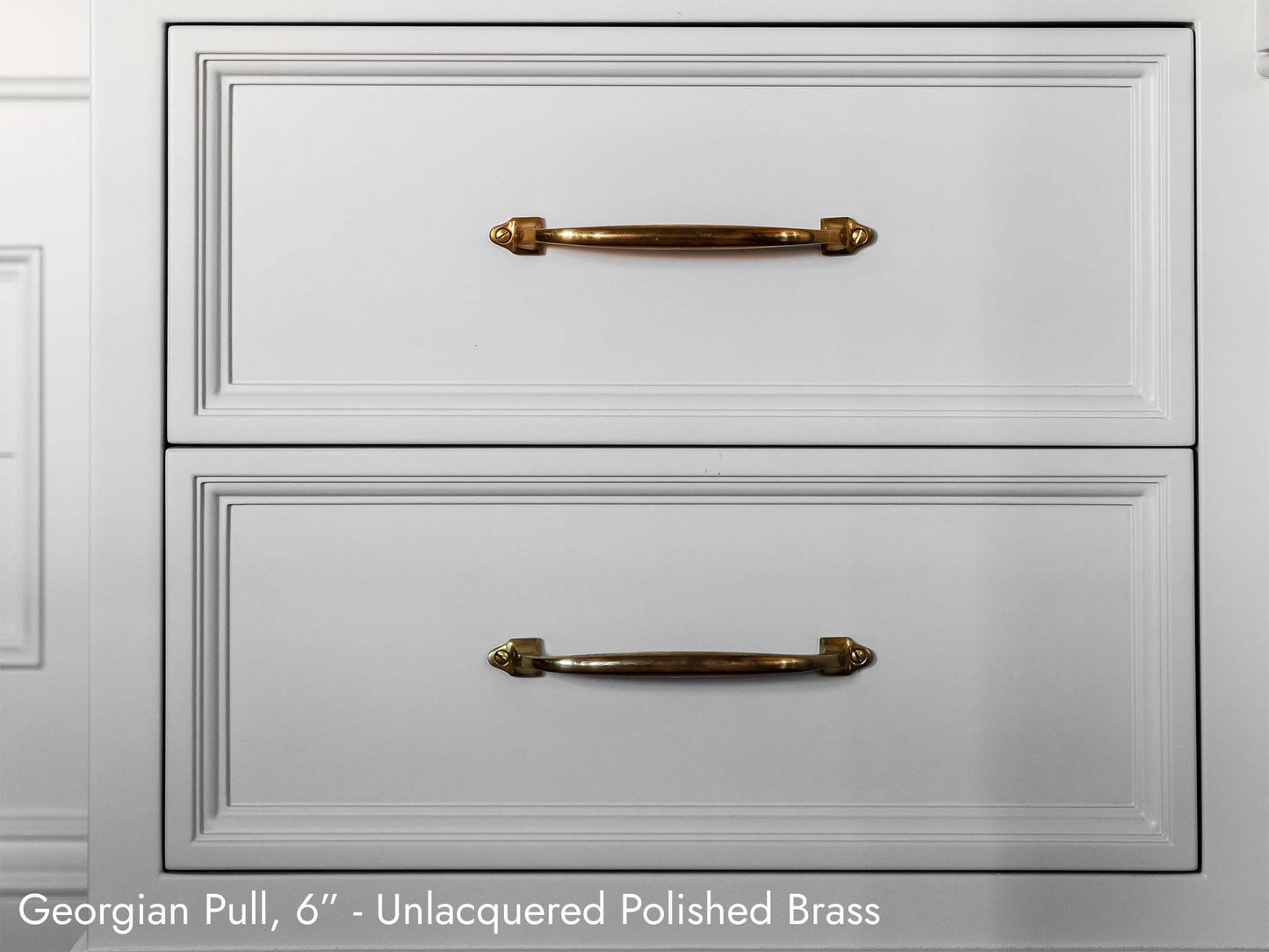 Solid brass Georgian Pull, in unlacquered polished brass, on kitchen cabinets.