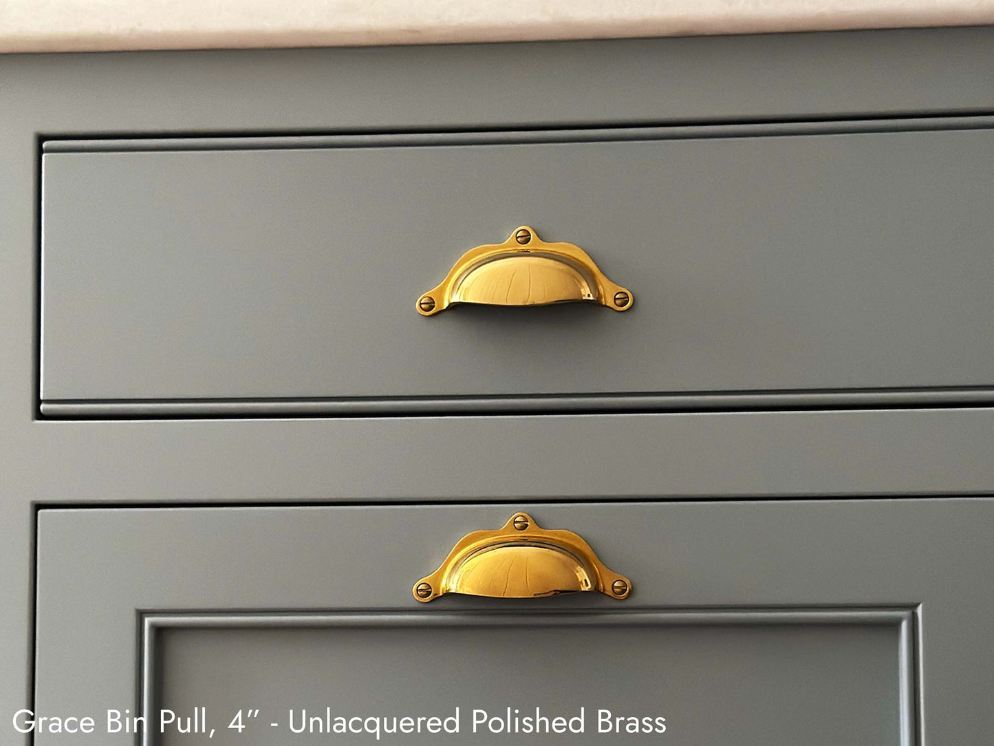 Solid brass Grace Bin Pull 4 inch, in unlacquered polished brass finish.