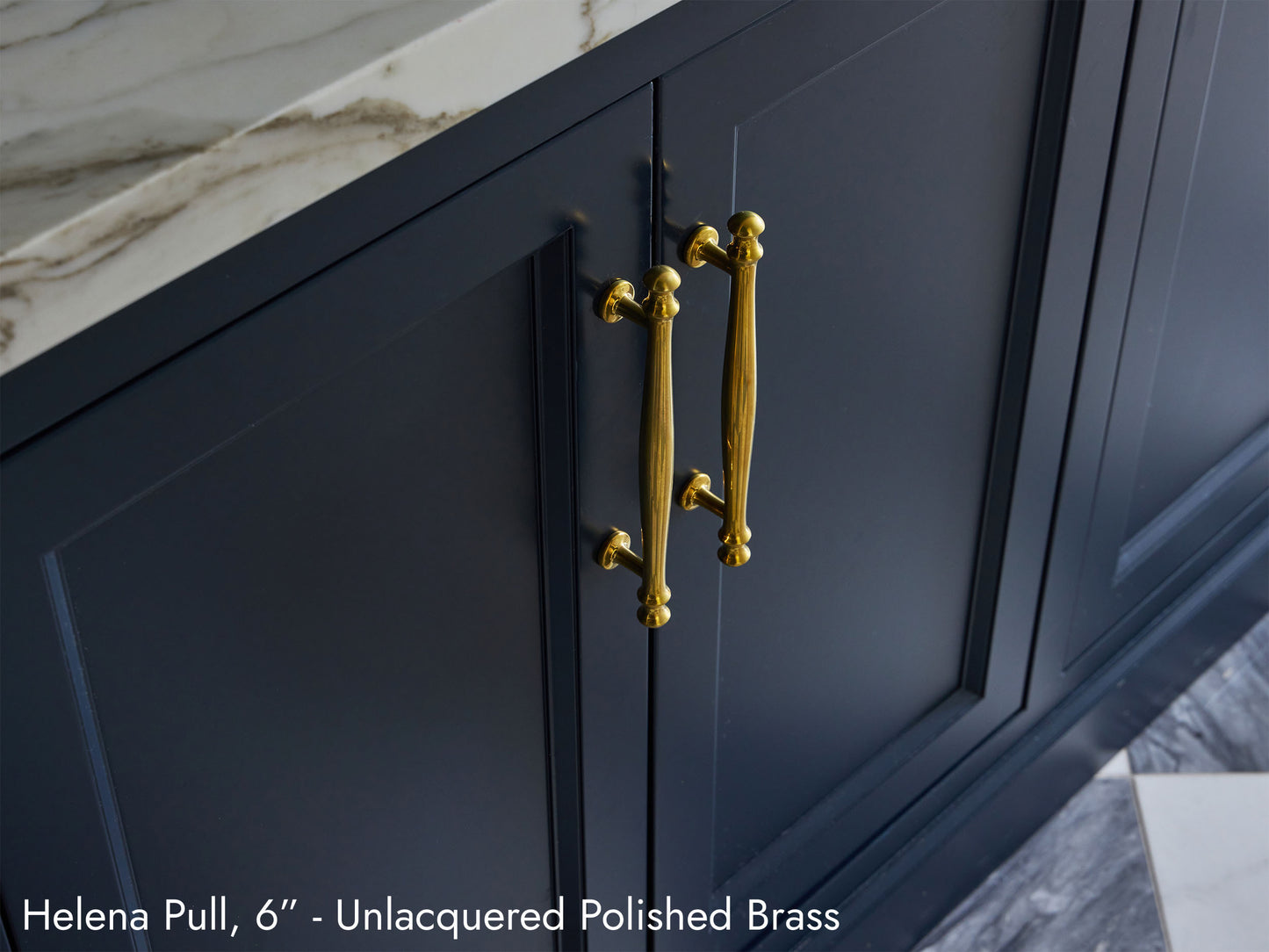 Solid brass Helena Pulls, in unlacquered polished brass finish, on kitchen cabinets.