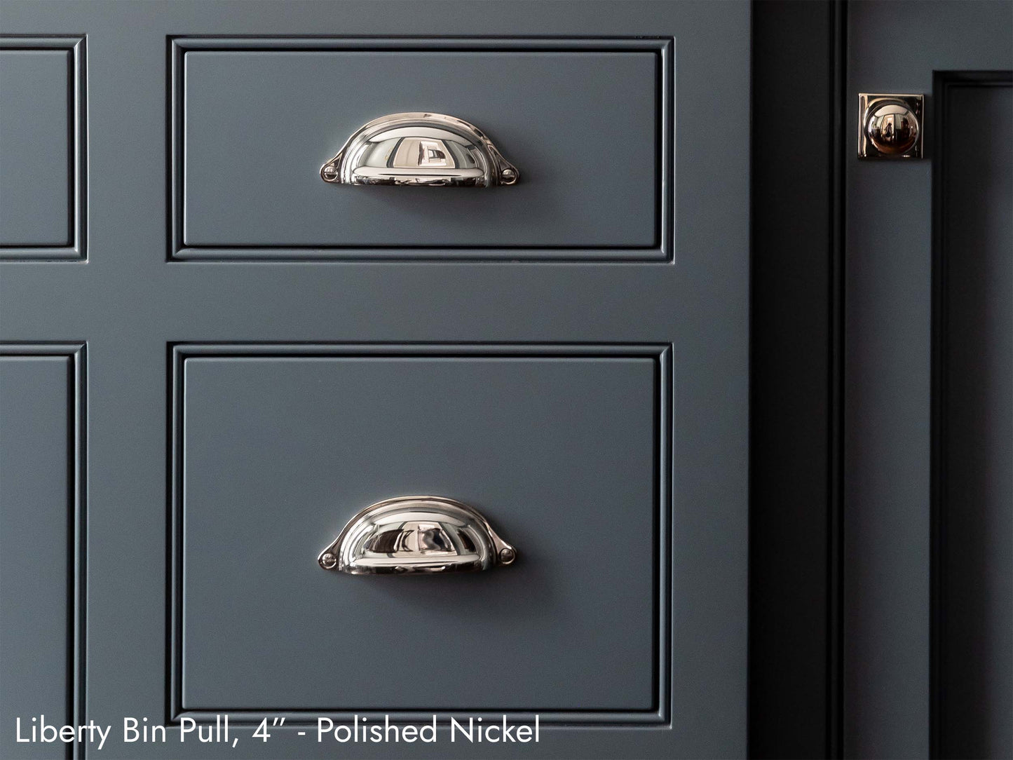 Solid brass Liberty Bin Pull, in polished nickel, on kitchen cabinets.