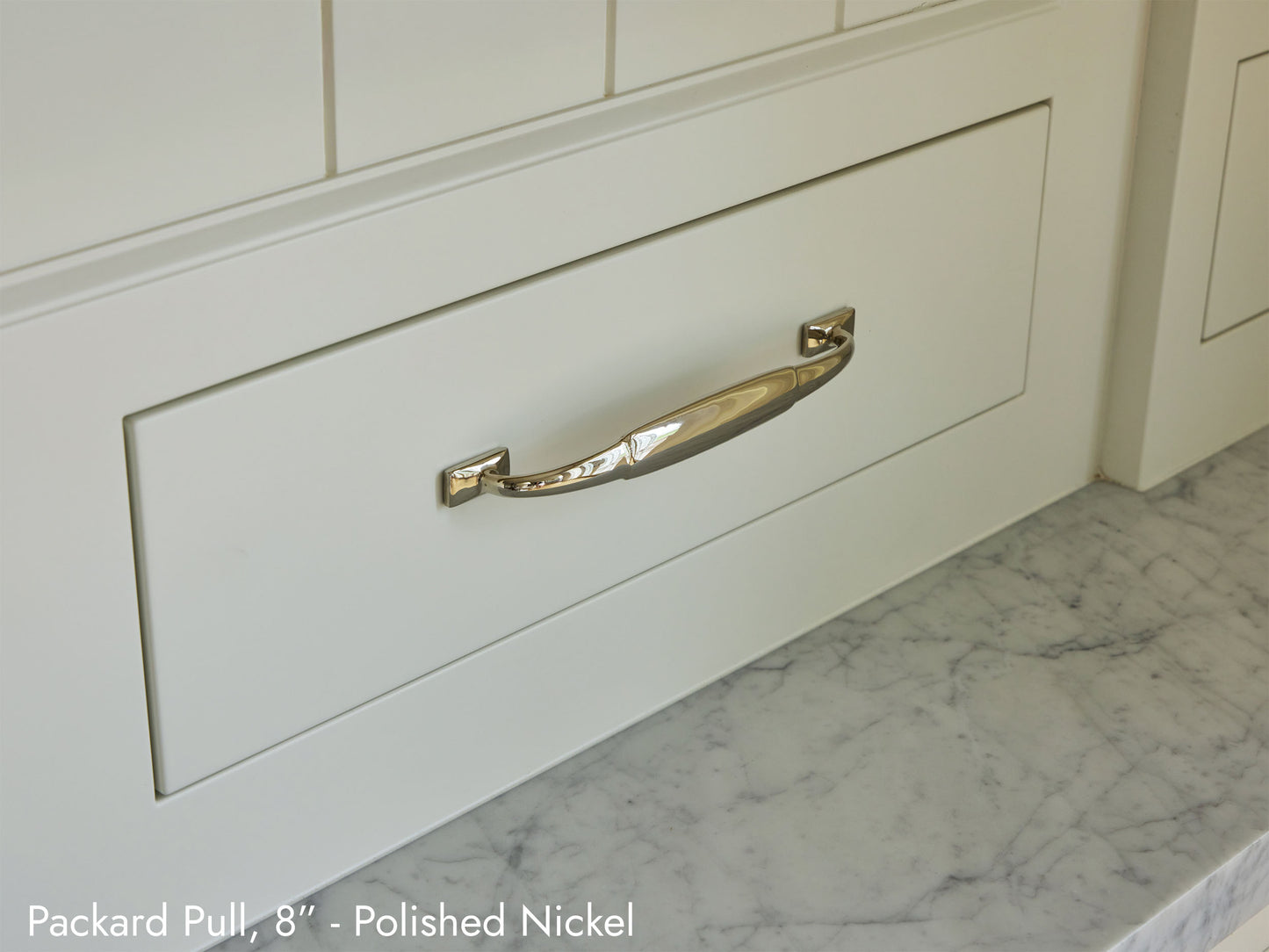 Solid brass Packard Pull, in polished nickel finish, on kitchen cabinets.