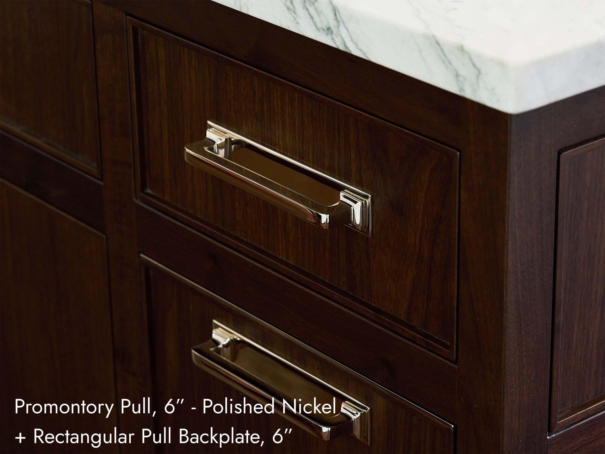 Solid brass Promontory Pull, in polished nickel finish, on kitchen cabinets.