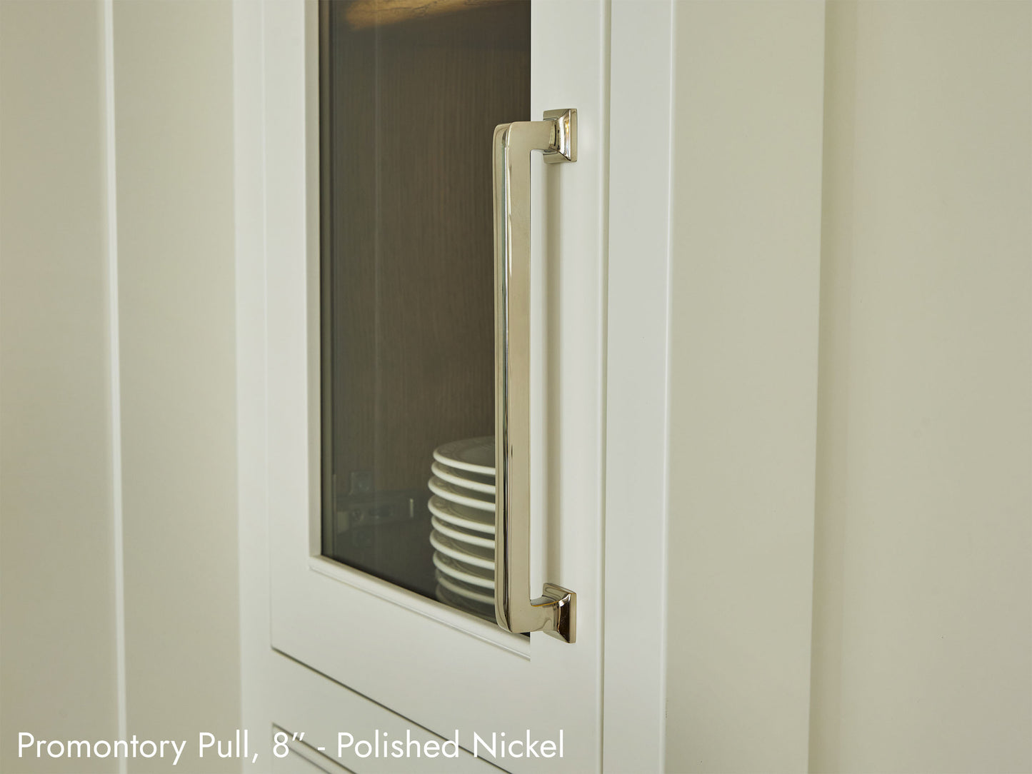 Solid brass Promontory Pull, in polished nickel finish, on kitchen cabinets.