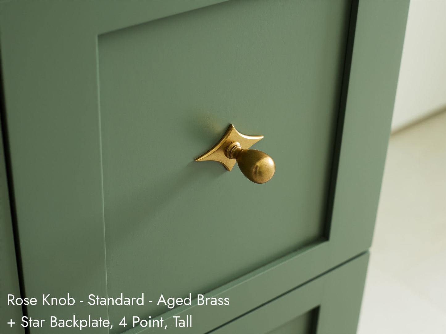 Solid brass Rose Knob, in aged brass finish, on kitchen cabinets with Star Backplate.