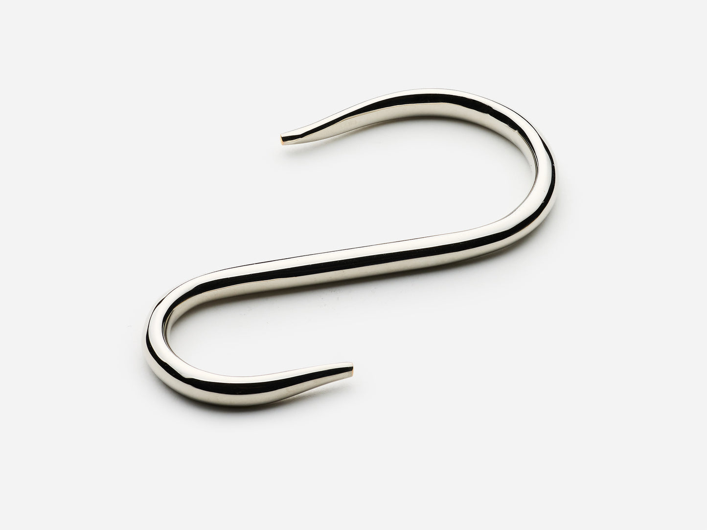 Solid brass S-hook for hanging pot rail in a polished nickel finish for kitchens.