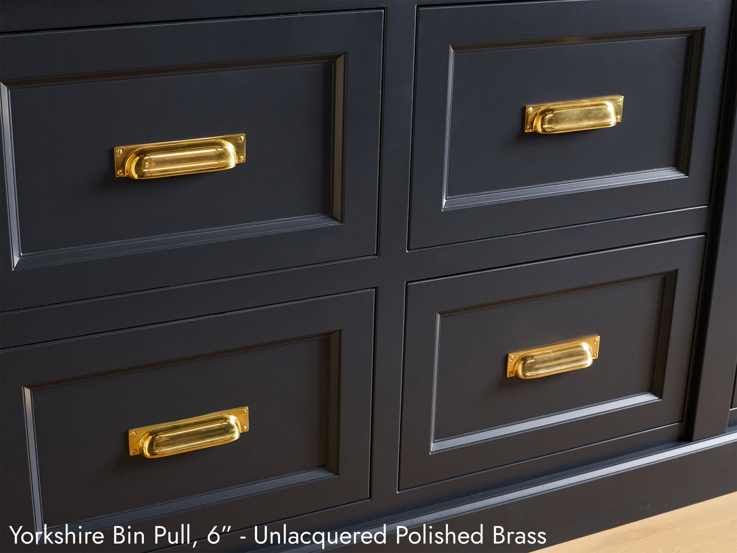 Solid brass Yorkshire Pulls, in a unlacquered polished brass finish, on kitchen cabinets.
