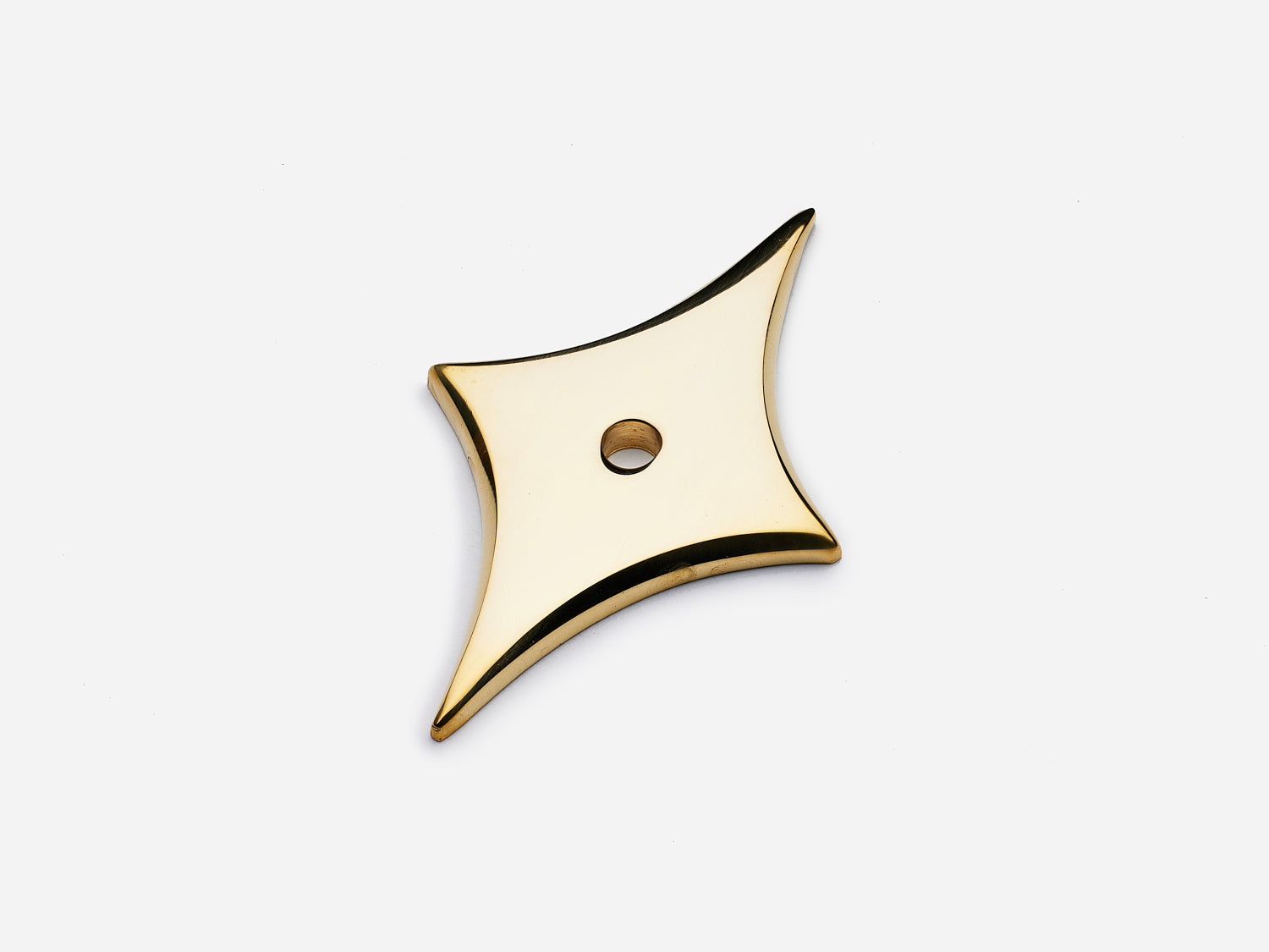 Solid brass 4-Point Tall Star backplate, in an unlacquered polished brass finish for knobs on cabinets.