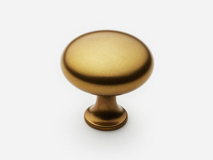 Solid brass Belle Knob, large size, in an aged brass finish for cabinets.
