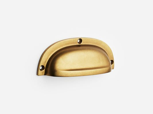 Solid brass Admiral bin pull, 4 inches, in an aged brass finish for cabinets.