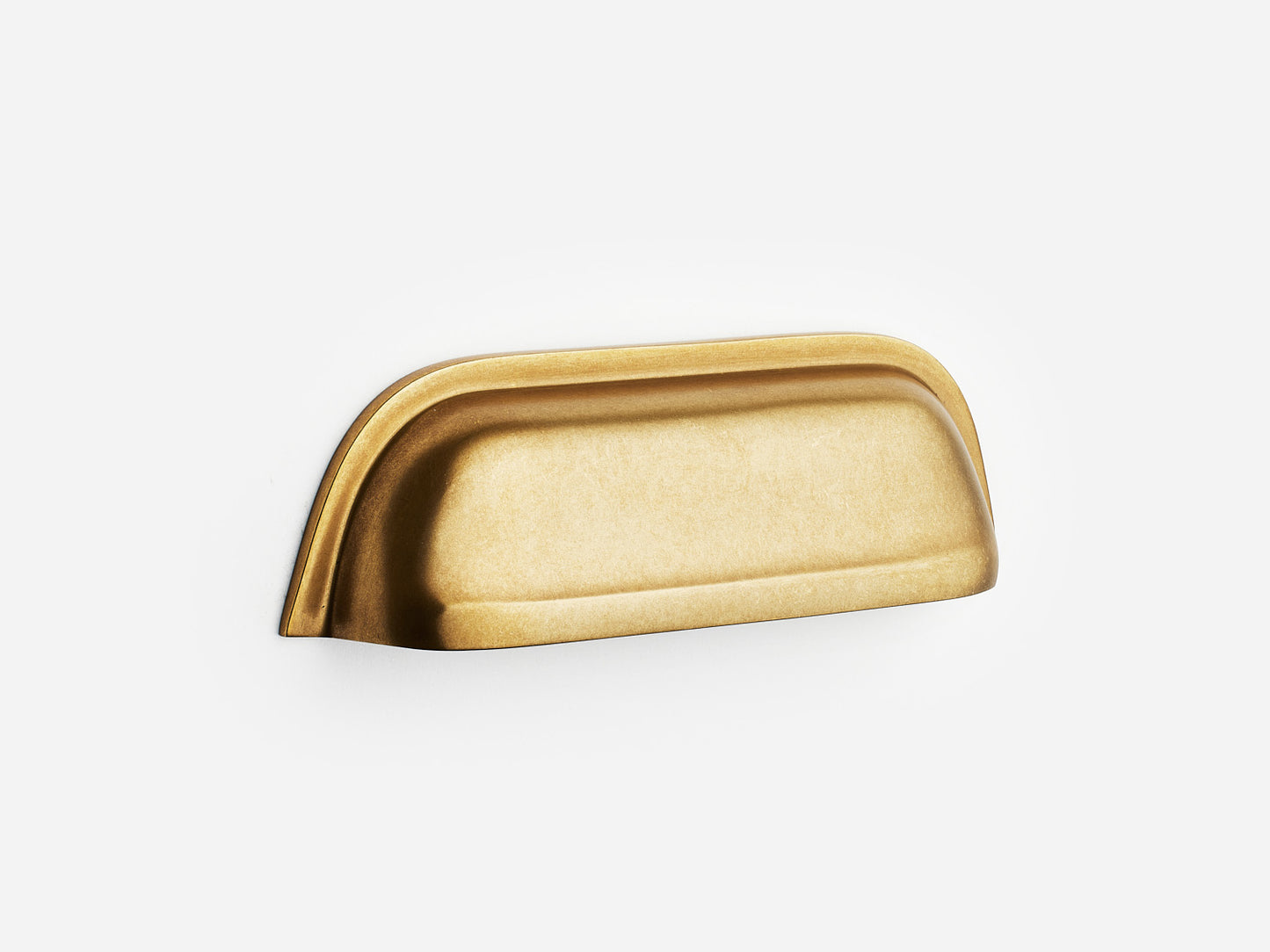 Solid brass Cygnet bin pull, 4 inches, in an aged brass finish for cabinets.